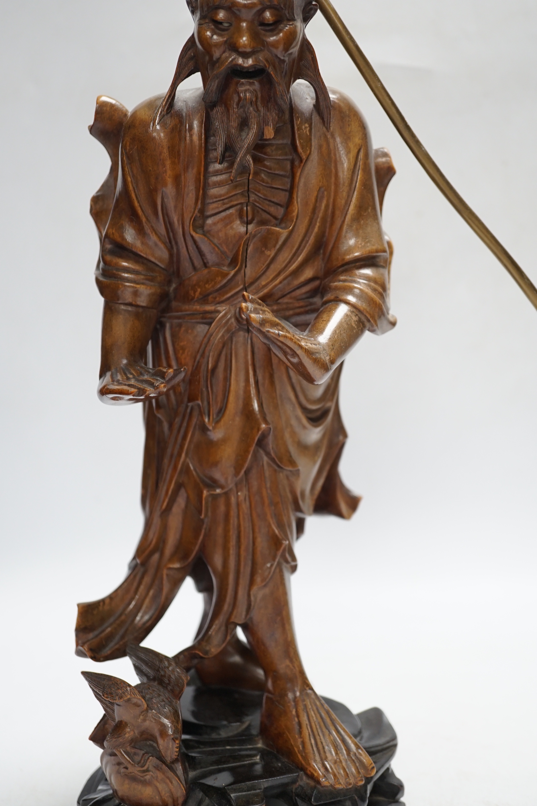 A Chinese carved wood figural table lamp, 43cm total